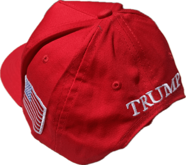 A red hat with the word " trump " on it.