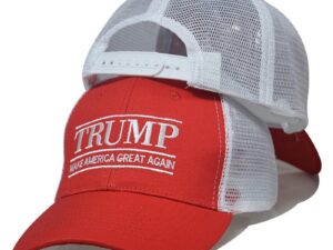 A red and white hat with the words " trump " on it.