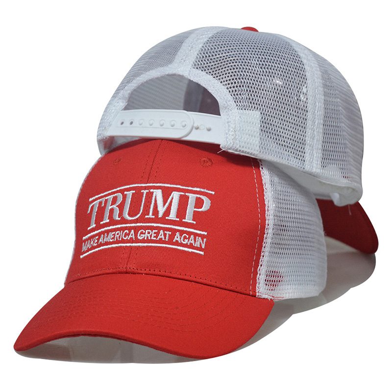 A red and white hat with the words " trump " on it.