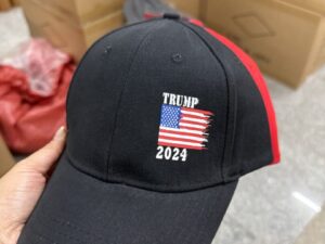 A person wearing a hat with the words " trump 2 0 2 4 " on it.