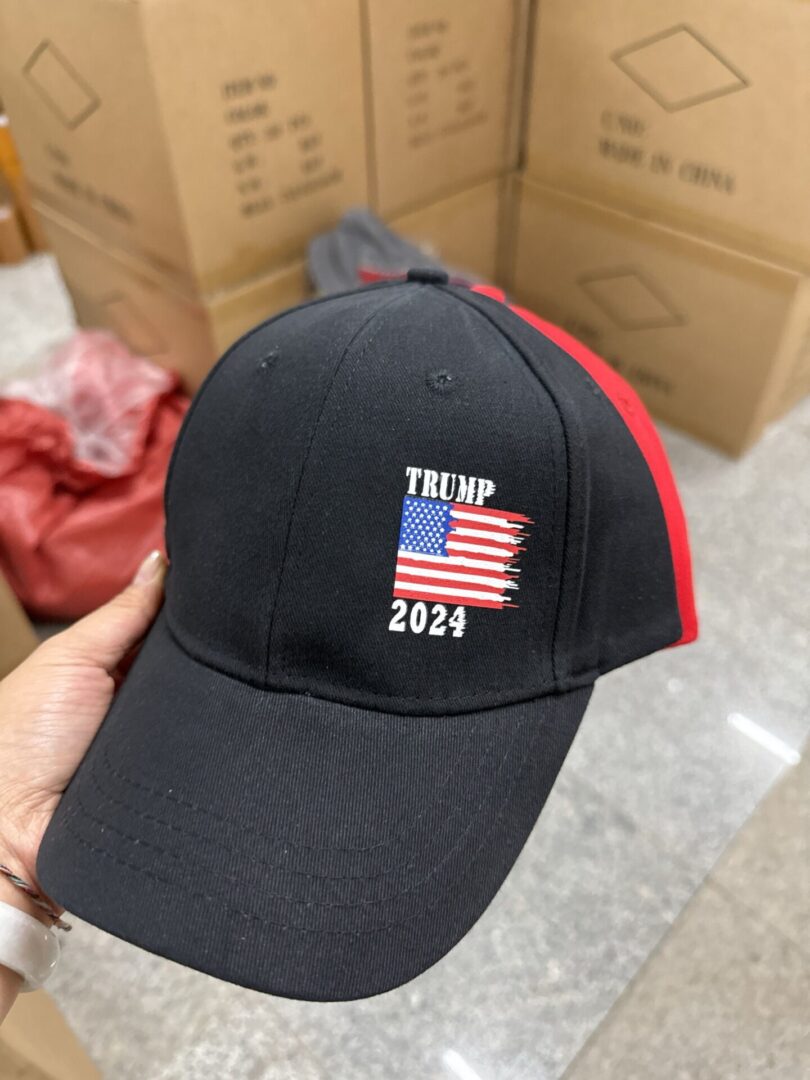 A person wearing a hat with the words " trump 2 0 2 4 " on it.